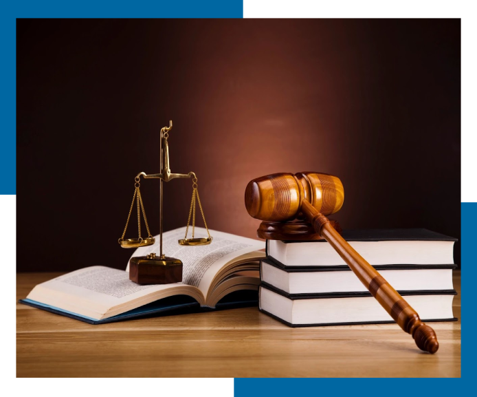 A judge 's gavel and scale on top of books.